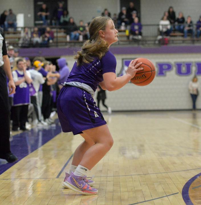 Albany&#39;s Savanna Pelzer prepares a 3-point shot on the baseline against Foley at Albany High School on Friday, Jan. 28, 2022. 