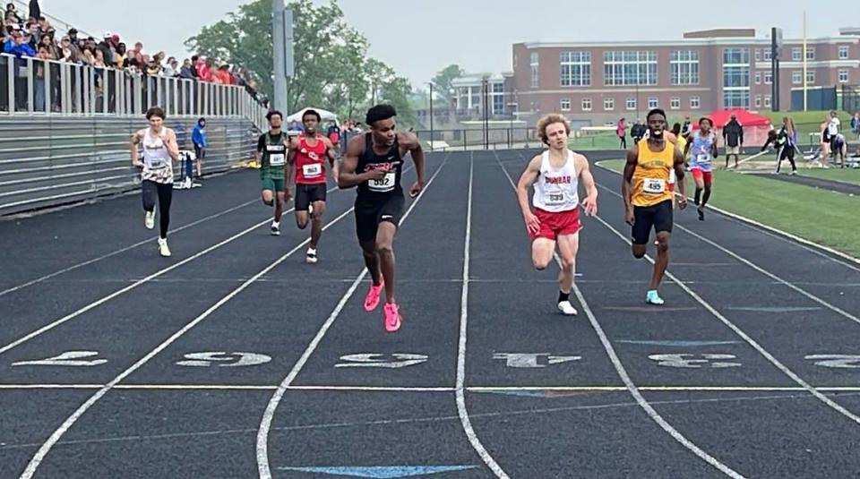 George Rogers Clark’s Jerone Morton leans for the finish line to win the 400 meters Saturday. He beat Paul Laurence Dunbar’s Brock Kaczmarek by four-tenths of a second.