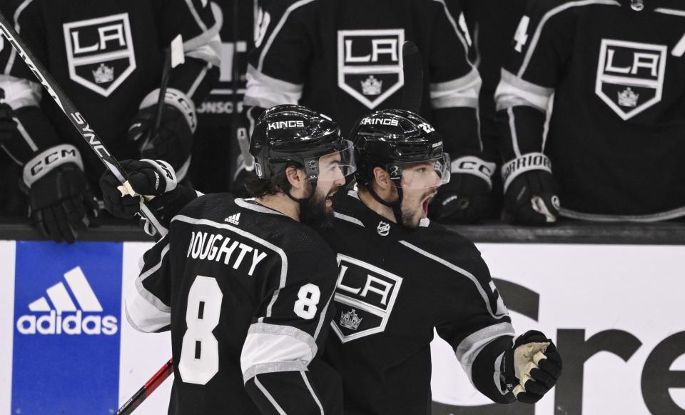 Los Angeles Kings' Kevin Fiala, right, celebrates with Drew Doughty after scoring against the Edmonton Oilers during the second period in Game 6 of an NHL hockey Stanley Cup first-round playoff series in Los Angeles on Saturday, April 29, 2023. (Keith Birmingham/The Orange County Register via AP)