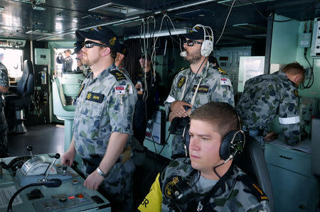 Crew members can be seen aboard the Royal Australian Navy frigate HMAS Stuart during Australia's largest maritime exercise 'Exercise Kakadu' being conducted off the coast of Darwin in northern Australia, September 7, 2018. Picture taken September 7, 2018. REUTERS/Jill Gralow