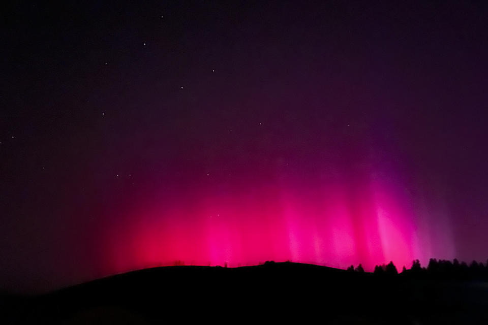 In this photo released by Xinhua News Agency, the Northern Lights, or Aurora Borealis, are seen near Nanshan scenic spot in Urumqi in northwestern China's Xinjiang Uyghur Autonomous Region, Saturday, May 11, 2024. An unusually strong solar storm hitting Earth produced stunning displays of color in the skies across the Northern Hemisphere early Saturday, with no immediate reports of disruptions to power and communications. (Chen Shuo/Xinhua via AP)