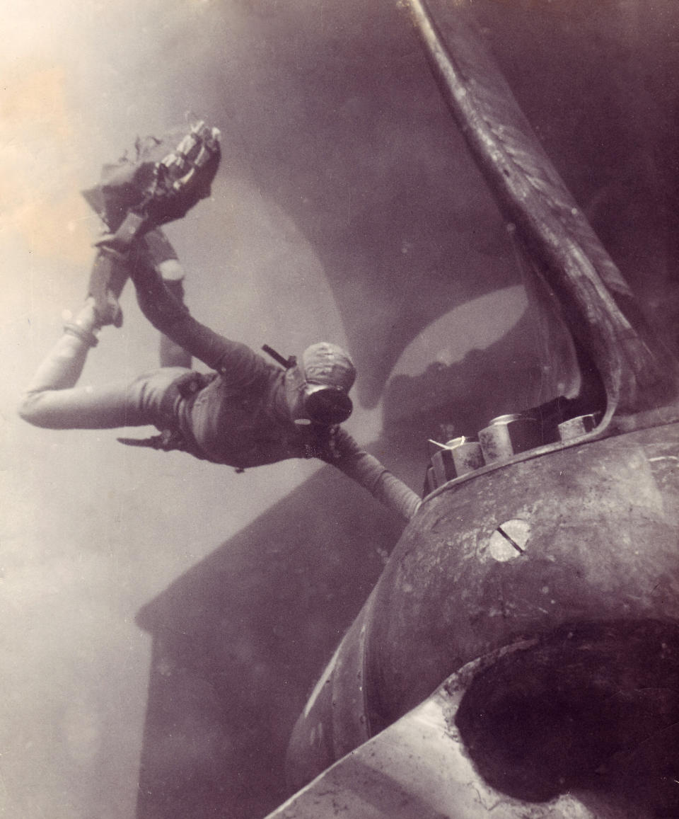 A UDT combat swimmer wearing a dry suit protective dress places a demolition charge on the propeller of a large capital ship during daylight training operations. A ship attack like this would normally be conducted under cover of darkness.  Photo: Courtesy of Tom Hawkins.