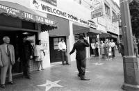 <p>Charlie Chaplin poses near his star on the Walk of Fame. </p>