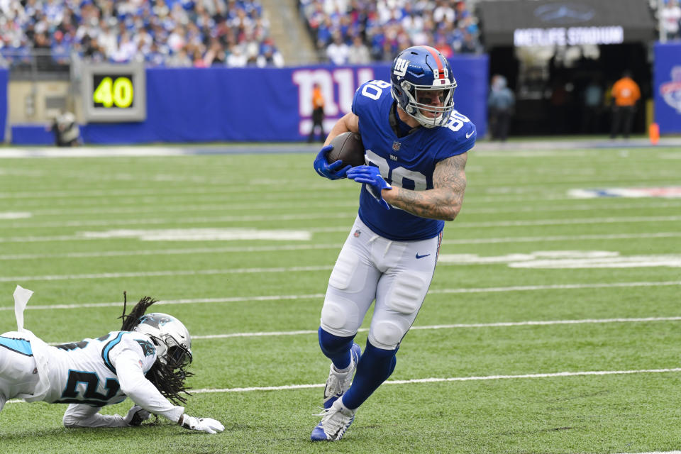 New York Giants tight end Kyle Rudolph (80) runs past Carolina Panthers' Donte Jackson (26) during the first half of an NFL football game, Sunday, Oct. 24, 2021, in East Rutherford, N.J. (AP Photo/Bill Kostroun)