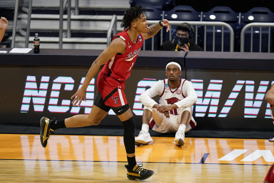 Texas Tech guard Terrence Shannon Jr. (1) celebrates after a three-point basket against Arkansas in the first half of a second-round game in the NCAA men's college basketball tournament at Hinkle Fieldhouse in Indianapolis, Sunday, March 21, 2021. (AP Photo/Michael Conroy)