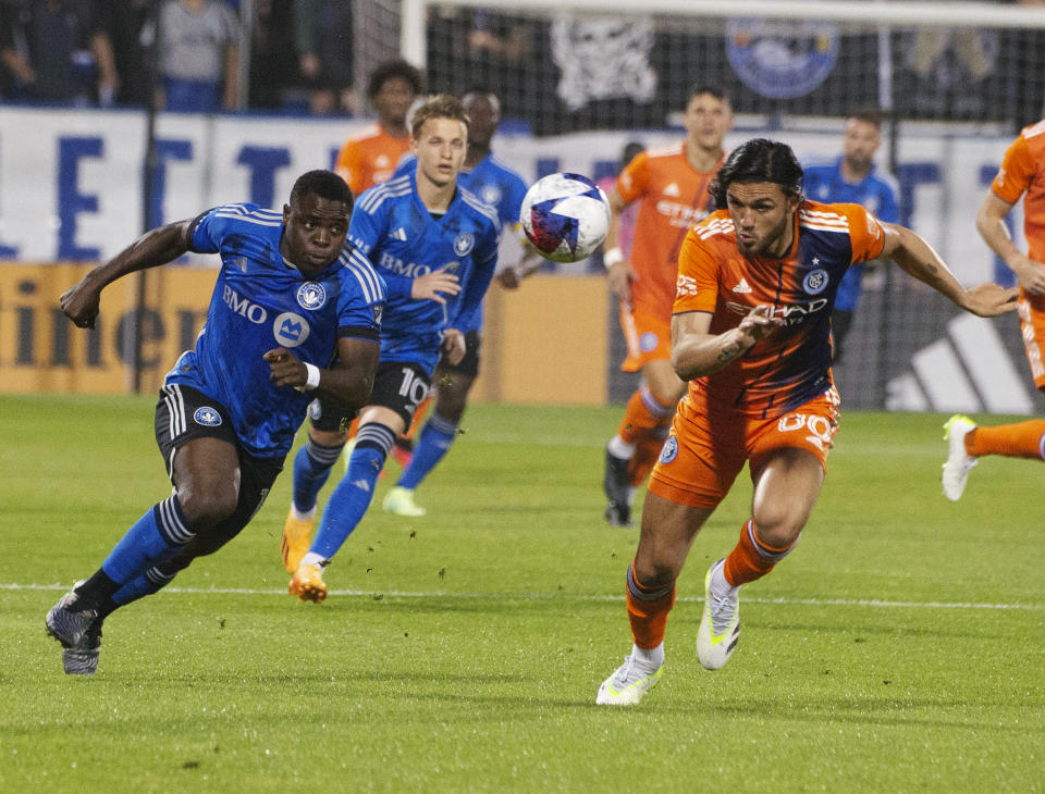 CF Montreal's Sunusi Ibrahim, left, races New York City FC's Justin Haak to the ball during the first half of an MLS soccer match Saturday, July 1, 2023, in Montreal. (Peter McCabe/The Canadian Press via AP)