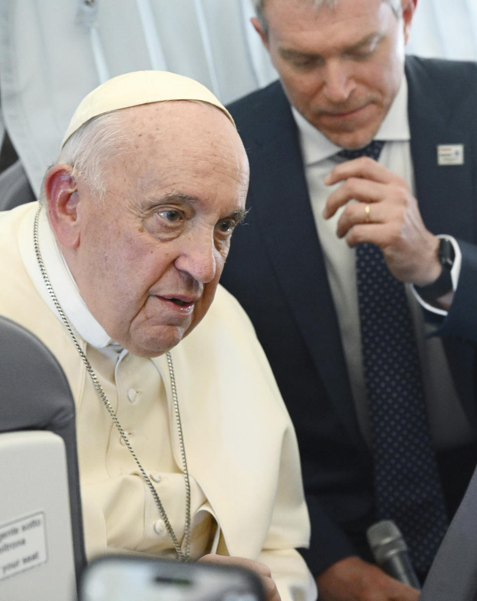 Pope Francis meets the journalists during a press conference aboard the airplane directed to Rome, at the end of his pastoral visit to Hungary, Sunday, April 30, 2023. (Vincenzo Pinto/Pool Photo Via AP)