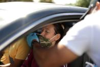 Lauren Louks, 24, is given a PCR coronavirus test, as the global outbreak of the coronavirus disease (COVID-19) continues, in Malibu