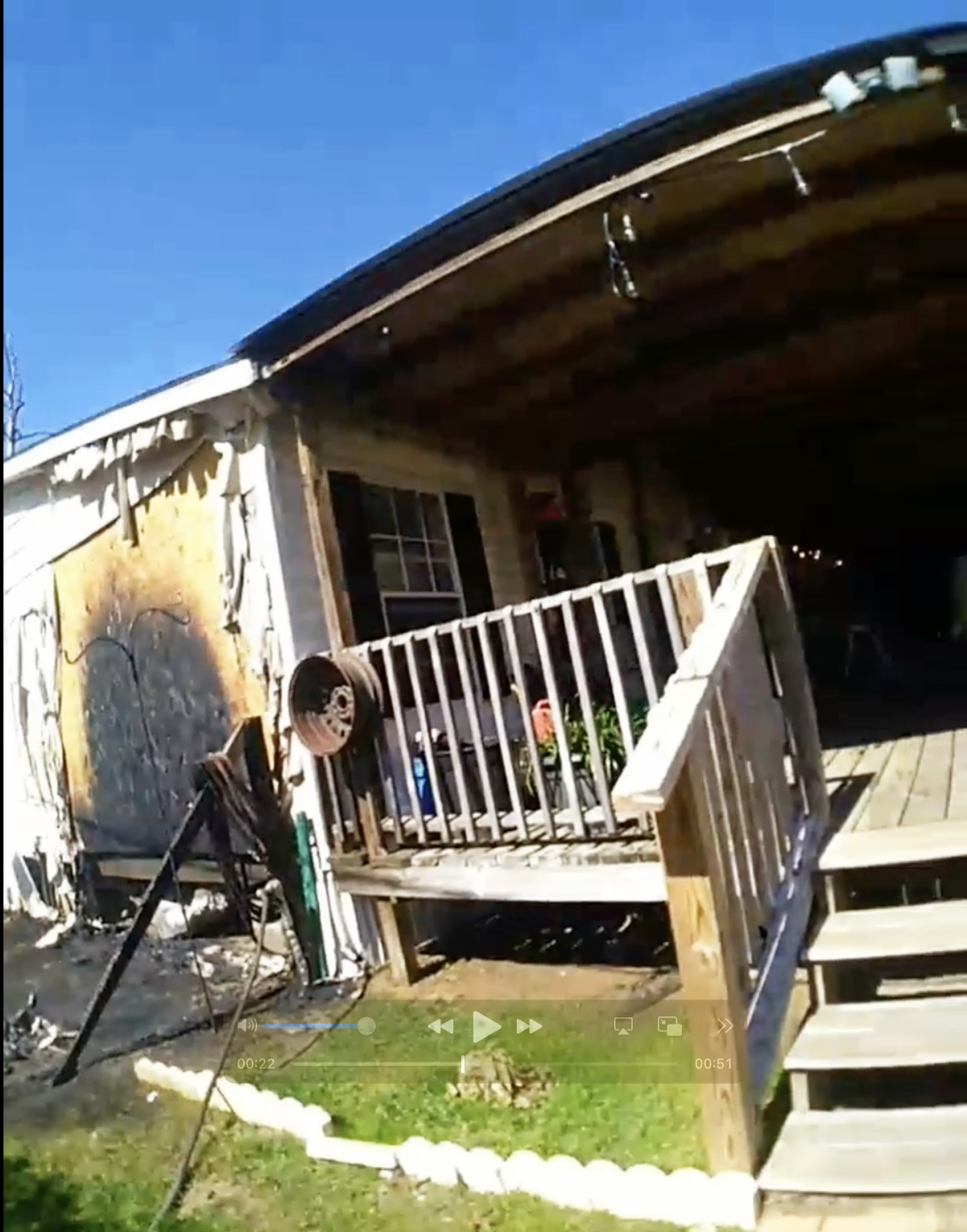 A Walton County sheriff's deputy's body camera footage shows a home in Mossy Head that was damaged by a fire Sunday. A postal worker sprang into action and called 911 after he spotted the fire outside the home.