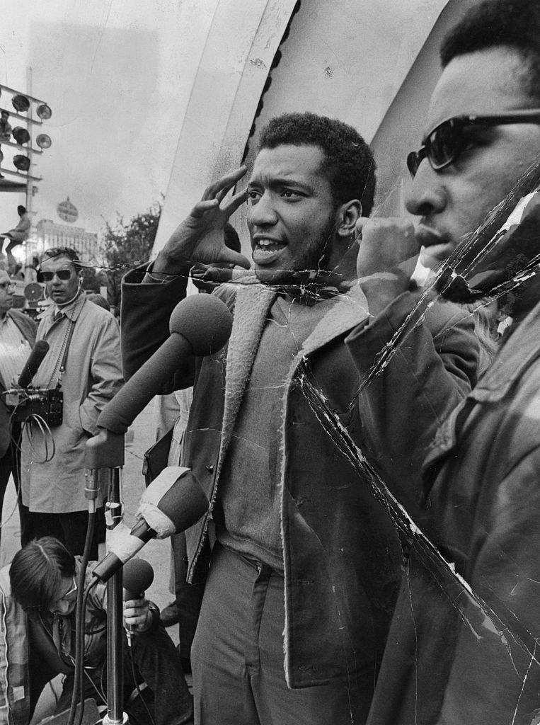 Fred Hampton speaking at a microphone