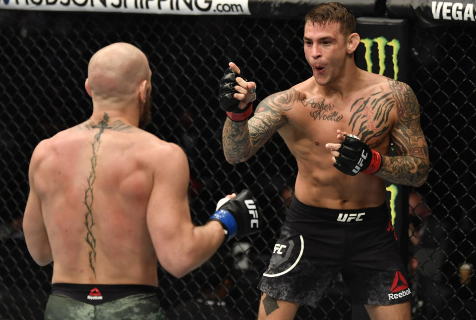 ABU DHABI, UNITED ARAB EMIRATES - JANUARY 23: (R-L) Dustin Poirier points at Conor McGregor of Ireland in a lightweight fight during the UFC 257 event inside Etihad Arena on UFC Fight Island on January 23, 2021 in Abu Dhabi, United Arab Emirates. (Photo by Jeff Bottari/Zuffa LLC)