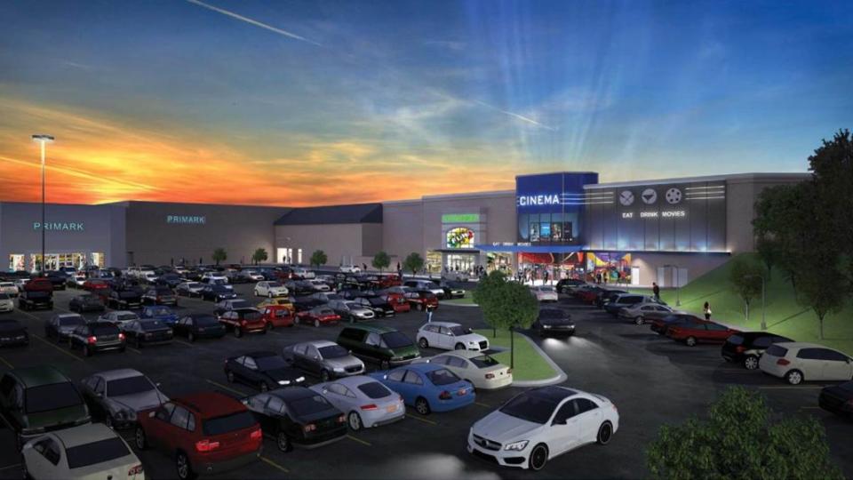 A rendering of a cinema and a parking lot at a mall.