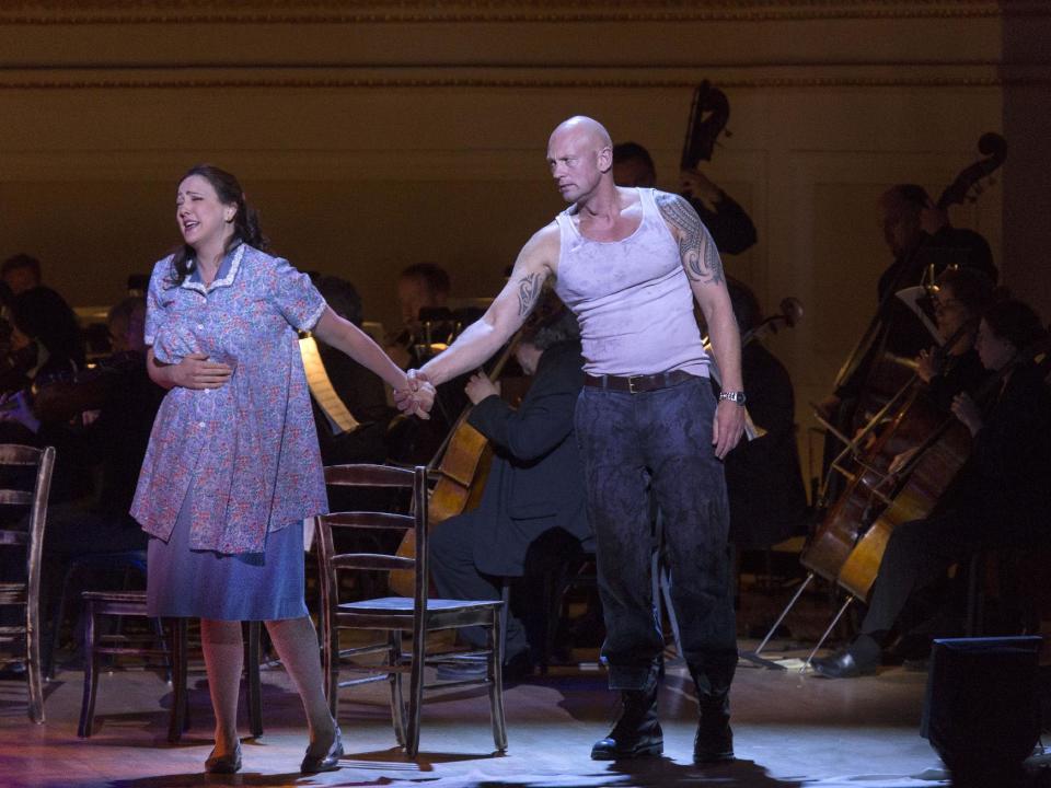 This March 14, 2013 publicity photo provided by Carnegie Hall shows Susanna Phillips, Soprano as Stella Kowalski, left, and Teddy Tahu Rhodes, Baritone as Stanley Kowalski, in a scene from Andre Previn's , "A Streetcar Named Desire," in the Stern Auditorium, at Carnegie Hall in New York. (AP Photo/Carnegie Hall, Richard Termine)