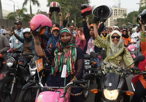 It is not uncommon to see women on motorcycles in Pakistan -- but usually they are perched in the dangerous side saddle position behind a male driver