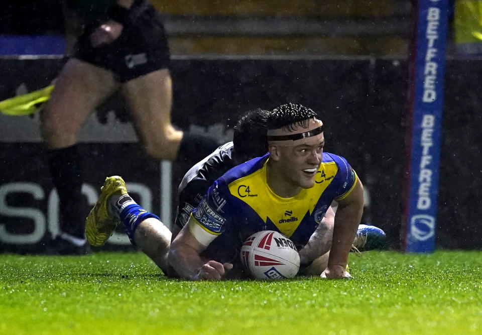 Warrington Wolves' Josh Thewlis scores a try.