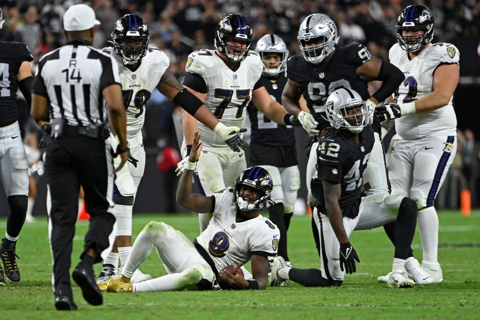 Baltimore Ravens quarterback Lamar Jackson (8) reacts after a play against the Las Vegas Raiders during the second half of an NFL football game, Monday, Sept. 13, 2021, in Las Vegas. (AP Photo/David Becker)