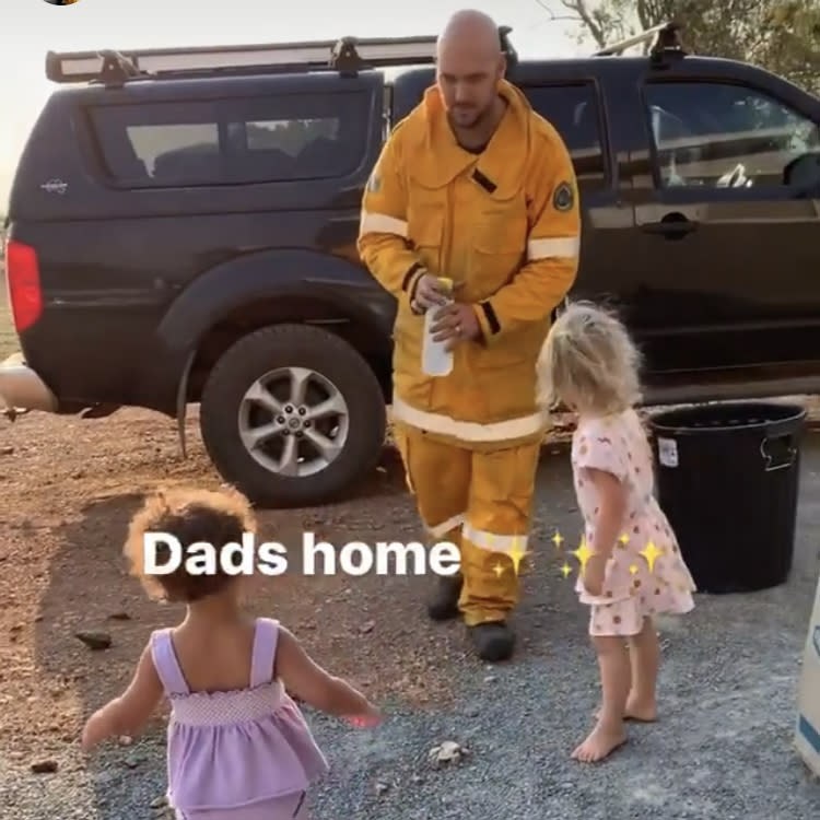 Temil Ludwig spent 27 hours fighting the fires near Yeppoon in Central Queensland. When he got home, his little girls gave him a hero's welcome. Source: Michelle Ludwig