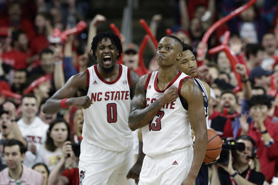 NC State guard C.J. Bryce (13) and forward D.J. Funderburk (0) react following a play against Duke in the second half of their 22-point upset win against the Blue Devils on Wednesday night.
