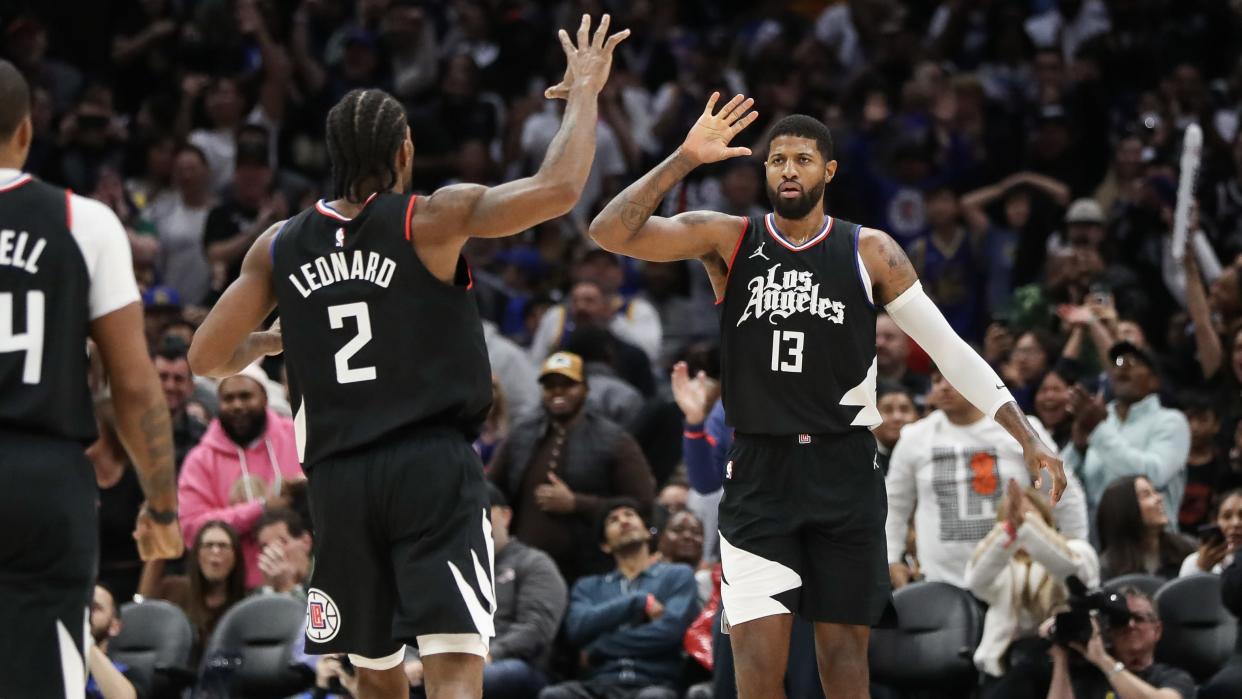 LOS ANGELES, CALIFORNIA - DECEMBER 02: Paul George #13 of the LA Clippers reacts to his shot in the end of the fourth quarter against the Golden State Warriors with Kawhi Leonard #2 at Crypto.com Arena on December 02, 2023 in Los Angeles, California. NOTE TO USER: User expressly acknowledges and agrees that, by downloading and or using this photograph, User is consenting to the terms and conditions of the Getty Images License Agreement. (Photo by Meg Oliphant/Getty Images)