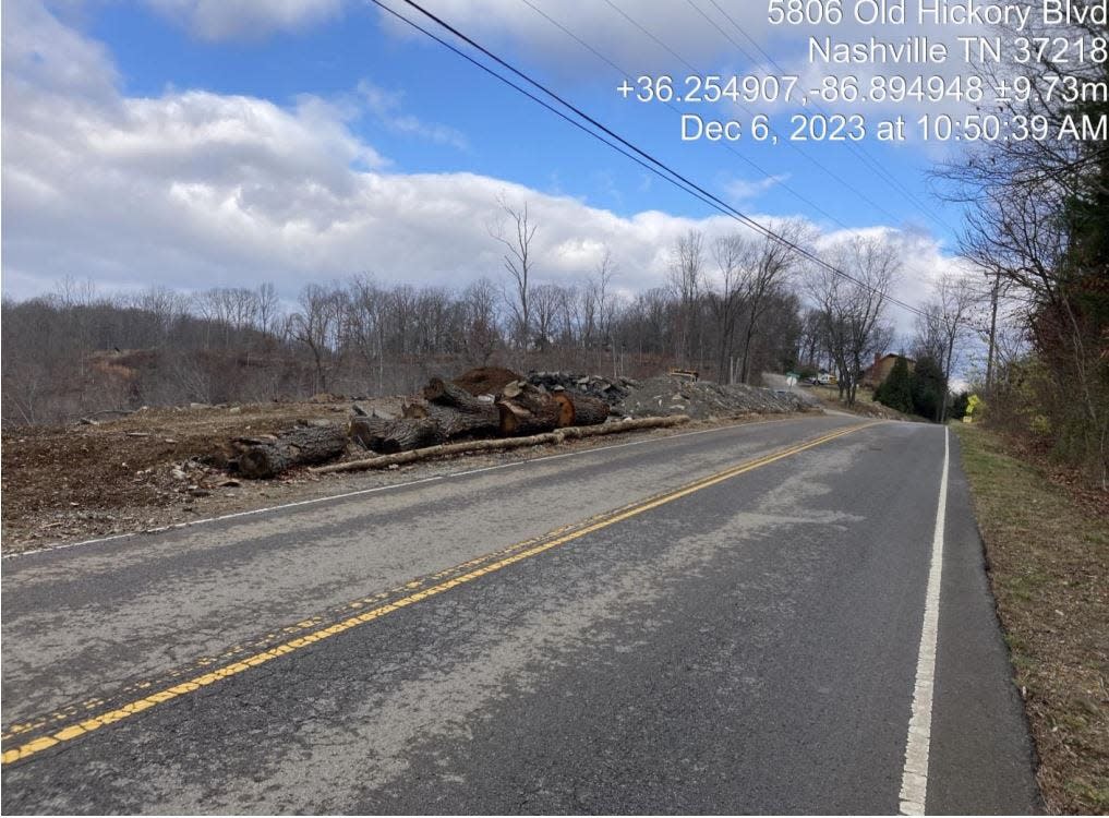 Large logs line the roadway at a property on Old Hickory Boulevard near Beaman Park in Nashville, as shown in Tennessee Department of Environment and Conservation inspection records dated Dec. 6, 2023.