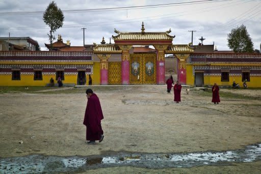 Buddhist monks are pictured outside a monastary in the town of Aba in China's Sichuan province. An 18-year-old nun in Aba set herself on fire and later died, rights groups said Sunday, the latest in a spate of such incidents among ethnic Tibetans protesting Beijing's rule