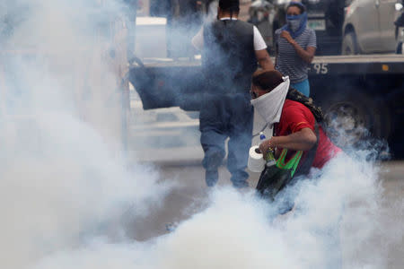 A woman is seen during a protest against the re-election of Honduras' President Juan Orlando Hernandez in Tegucigalpa, Honduras January 20, 2018. REUTERS/Jorge Cabrera