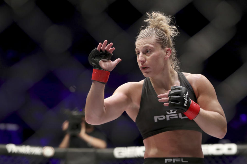 FILE - Kayla Harrison is shown during a PFL (Professional Fighters League) bout against Larissa Pacheco at Nassau Coliseum in Uniondale, N.Y., in this Thursday, May 9, 2019, file photo. Harrison's new bio reads, Olympic gold medalist, MMA champ, single mom. When tragedy struck her family, Harrison suddenly had to balance unexpected single motherhood with a blossoming career as an undefeated fighter for the PFL. Harrison is scheduled to fight against Cindy Dandois on Friday, June 25 in Atlantic City, N.J. (AP Photo/Greg Payan, File)