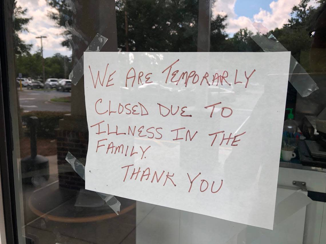 A sign posted on The Greek Table’s door says the Bluffton restaurant is closed temporarily because of illness. 