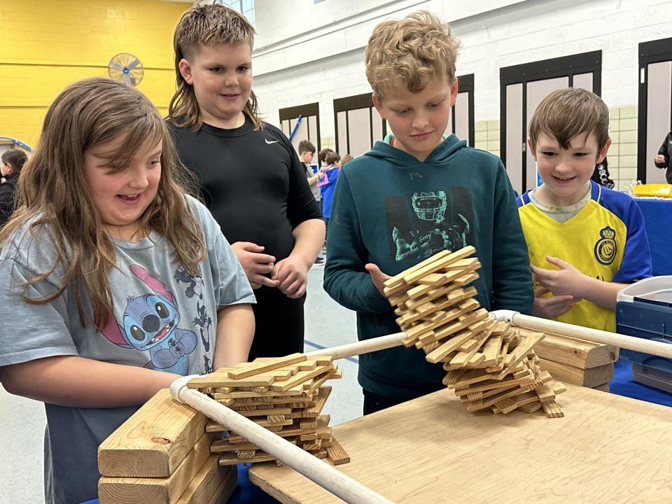 Eyler students (from left) Brooklyn Hayes, Carter Dostert, Gage Keatts and Zander Arnold work on their structures.