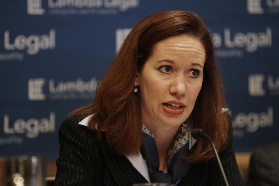 Camilla Taylor, marriage project director for Lambda Legal, speaks at a news conference, Wednesday, May 30, 2012, in Chicago. More than two dozen gay Illinois couples who say it’s unconstitutional for the state to deny them the right to marry and will file two lawsuits Wednesday, a move advocates believe could lead to legalized gay marriage in Illinois. The two lawsuits, filed by attorneys with the American Civil Liberties Union of Illinois and New-York based gay advocacy group Lambda Legal, include couples from Chicago and its suburbs, Bloomington and Marion. (AP Photo/M. Spencer Green)