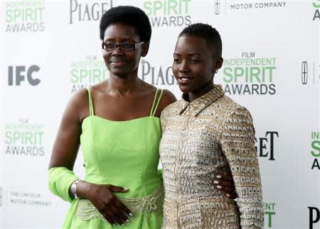 Nominee for Best Supporting Female award Lupita Nyong'o, from "12 Years a Slave," arrives with her mother Dorothy at the 2014 Film Independent Spirit Awards in Santa Monica, California March 1, 2014. REUTERS/Danny Moloshok