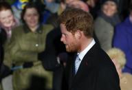 Britain's Prince Harry walks to a Christmas Day morning service at the church on the Sandringham Estate in Norfolk, eastern England, December 25, 2013. REUTERS/Andrew Winning (BRITAIN - Tags: ROYALS RELIGION)