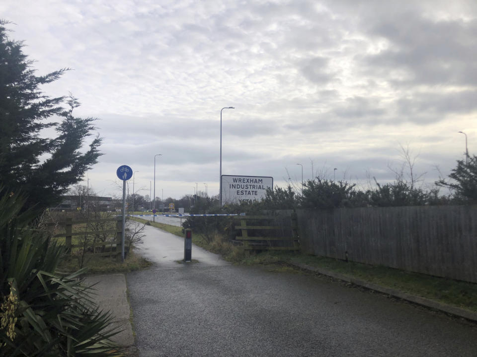 A police cordon at Wrexham Industrial Estate near the British pharmaceutical manufacturing company Wockhardt in Wrexham, north Wales, Wednesday Jan. 27, 2021. Wockhardt UK, an arm of the Mumbai-based pharmaceutical company that is producing the Oxford-AstraZeneca vaccine in north Wales, said it notified authorities after receiving a suspect package on Wednesday morning. (Eleanor Barlow/PA via AP)