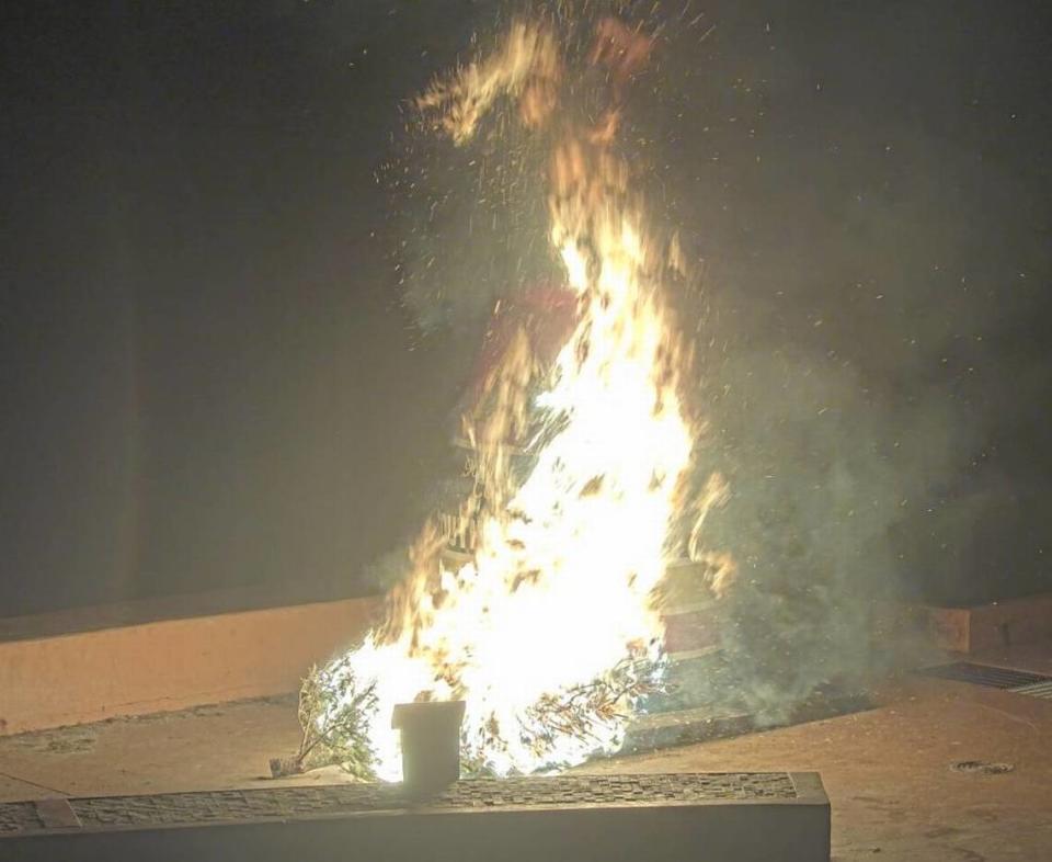 In this screenshot captured by a webcam, the Southernmost Point buoy in Key West burns early on Jan. 1, 2022, after two people set a fire in front of it, police said.