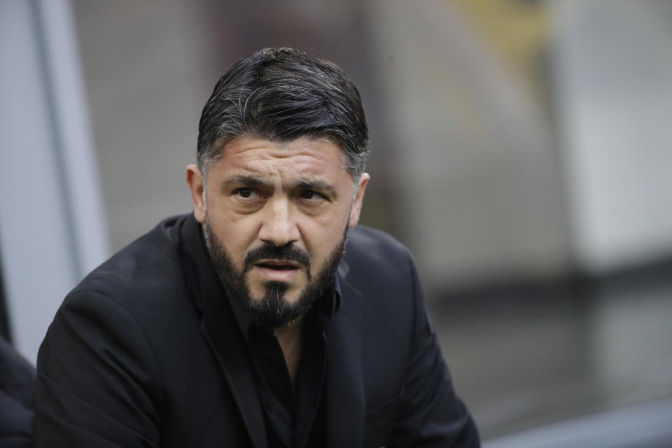 FILE - In this Saturday, Dec. 22, 2018 file photo, AC Milan coach Gennaro Gattuso waits for the start of a Serie A soccer match between AC Milan and Fiorentina, at the San Siro stadium in Milan, Italy. Amid reports of an imminent move to Chelsea and a mysterious fever, Gonzalo Higuain again lost his cool against his former club in what could have been his last match for AC Milan. Higuain was on the bench for most of Wednesday's Italian Super Cup against Juventus, officially due to "fever", but came on for the final 20 minutes. The Argentina forward had little impact and could not prevent 10-man Milan losing to Juventus but still made the headlines for the wrong reasons. (AP Photo/Luca Bruno, File )