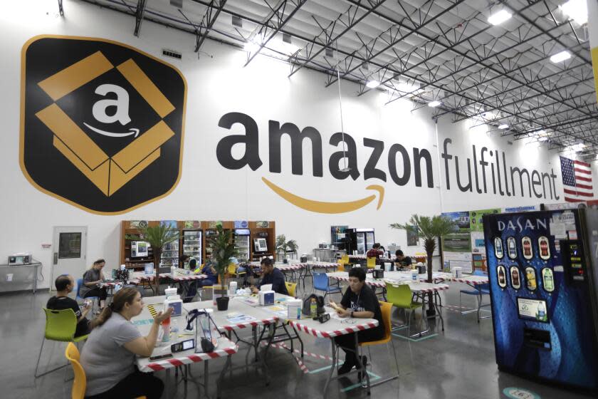 MORENO VALLEY, CA - SEPTEMBER 29, 2021 - - Workers enjoy a break at the Amazon Fulfillment Center in Moreno Valley, California, on September 29, 2021. (Genaro Molina / Los Angeles Times)