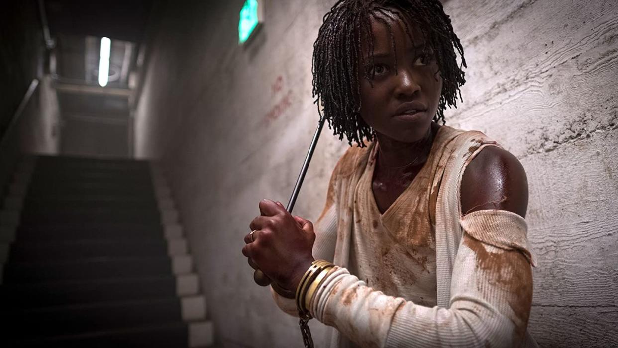 lupita nyongos addy is handcuffed and bloody in a scene from us a good housekeeping pick for best halloween movies