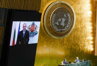 Bulgaria's President Rumen Radev is seen on a video screen as he addresses the 76th Session of the United Nations General Assembly remotely, Tuesday, Sept. 21, 2021 at U.N. headquarters. (AP Photo/Mary Altaffer, Pool)