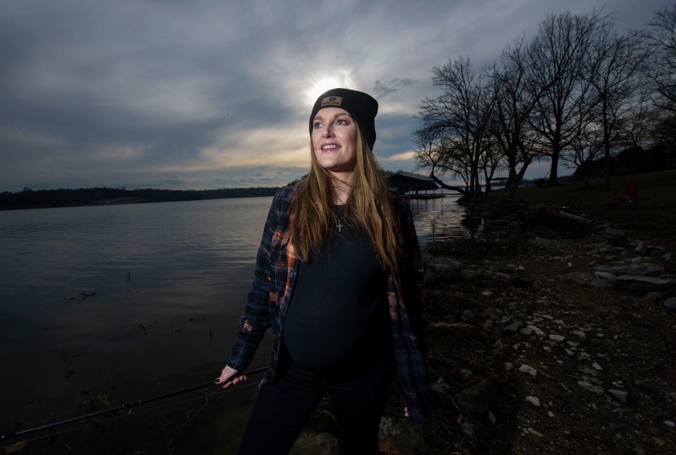 Kasey Tyndall stands for a portrait while fishing at Old Hickory Pier in Old Hickory , Tenn., Friday, Feb. 10, 2023.