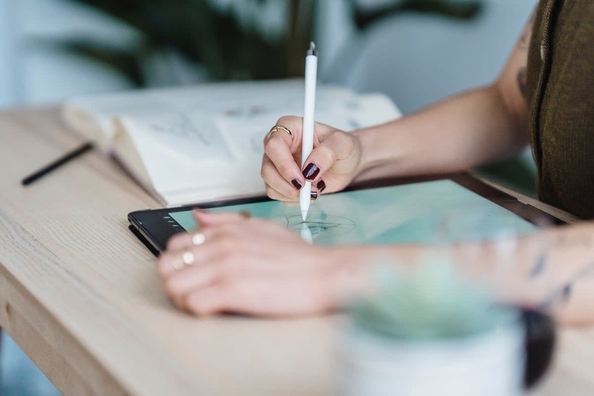 An artist drawing on an iPad (Michael Burrows / Pexels)