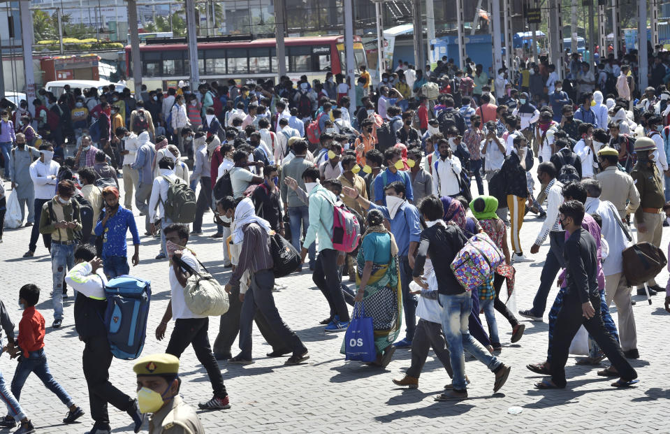 NEW DELHI, INDIA - MARCH 28: Migrant workers are seen in large numbers at Kaushambi Roadways Bus Stand on Day 4 of the 21 day nationwide lockdown -- to check the spread of coronavirus, at Kaushambi, on March 28, 2020 in New Delhi, India. (Photo by Ajay Aggarwal/Hindustan Times via Getty Images)