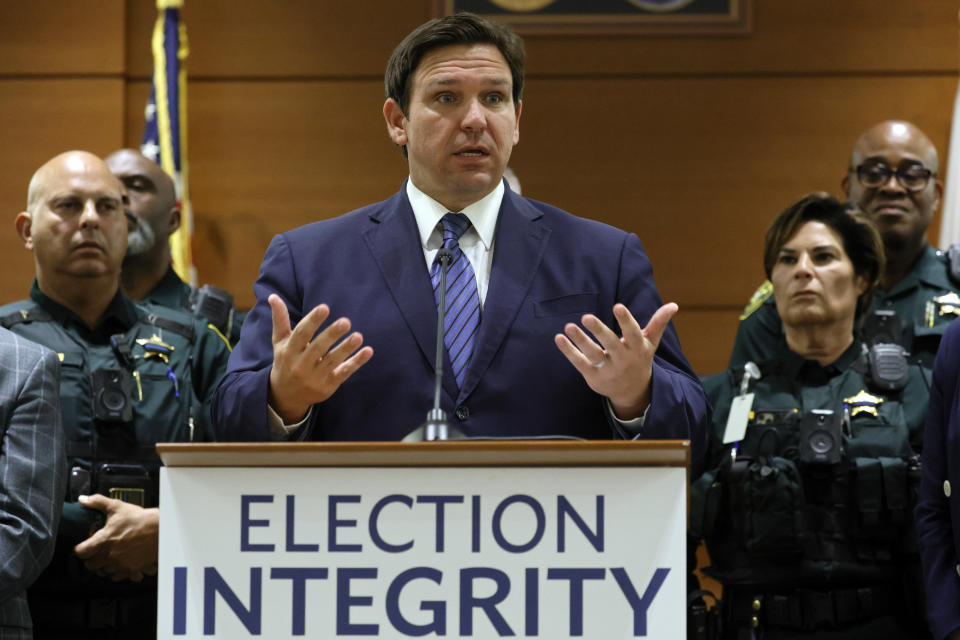 Florida Gov. Ron DeSantis speaks during a news conference at the Broward County Courthouse in Fort Lauderdale, Fla. on Thursday, Aug. 18, 2022. Florida Gov. Ron DeSantis on Thursday announced criminal charges against 20 people for illegally voting in 2020, the first major public move from the Republican's new election police unit. (Amy Beth Bennett/South Florida Sun-Sentinel via AP)