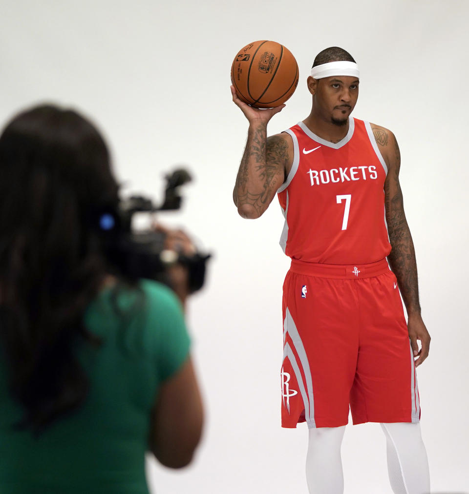 Houston Rockets' Carmelo Anthony (7) poses for a photographer during media day Monday, Sept. 24, 2018, in Houston. (AP Photo/David J. Phillip)