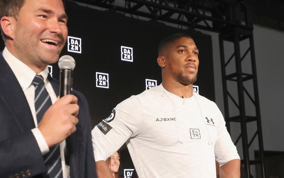 Eddie Hearn and Anthony Joshua on stage - GETTY IMAGES