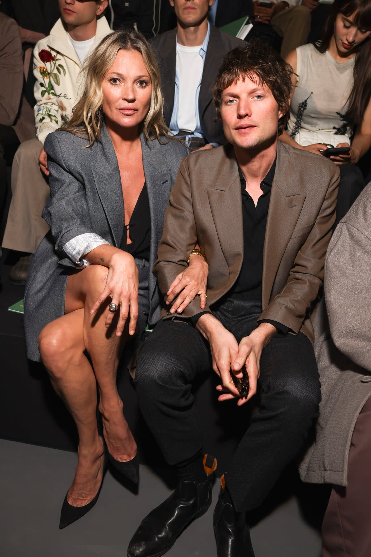 Kate Moss, left, and Nikolai von Bismarck attend the Dior Homme Spring Summer 2025 (Vianney Le Caer/Invision/AP)