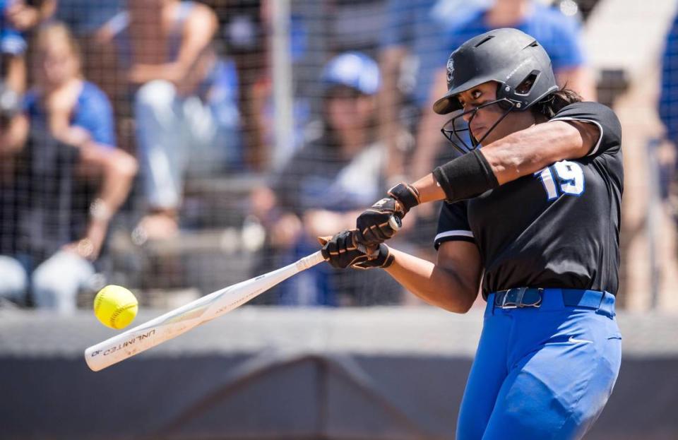 Capital Christian Cougars pitcher Ayla Tuua (19) gets cheers from Cougars fans as she connects for a deep foul ball during the seventh inning against the Dixon Rams at the CIF Sac-Joaquin Section Division IV high school softball championship game Saturday, May 27, 2023, at Cosumnes River College.