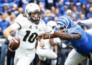 Oct 13, 2018; Memphis, TN, USA; Memphis defender John Tate IV (left) sacks Central Florida quarterback McKenzie Milton (right) at Liberty Bowl Memorial Stadium. Mandatory Credit: Mark Weber/The Commercial Appeal via USA TODAY NETWORK