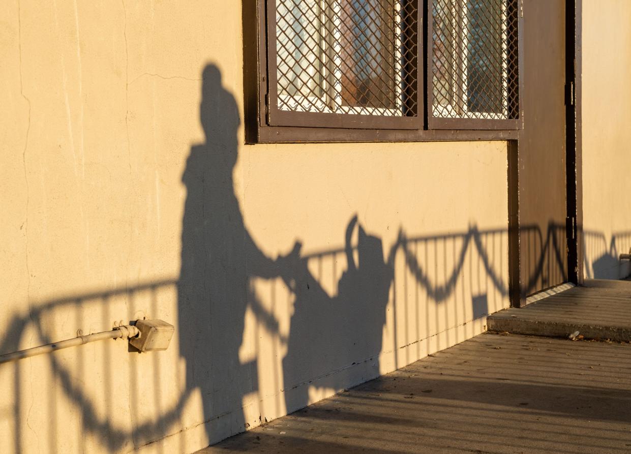 A mother pushes her baby in a stroller in Salinas, Calif., on Saturday, Dec. 11, 2021.