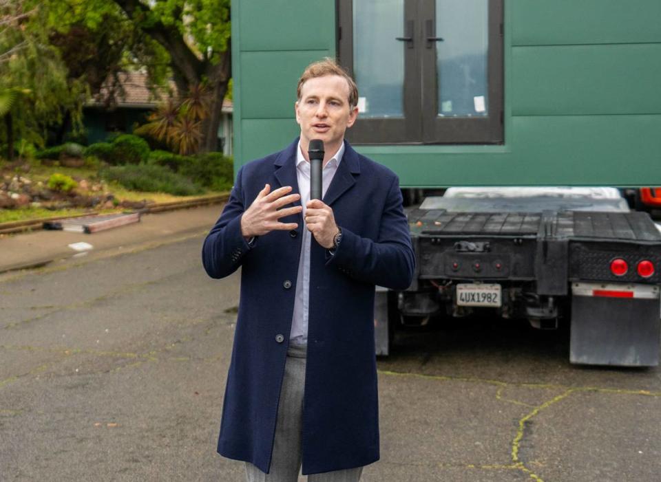 Airbnb co-founder Joe Gebbia addresses the crowd during the ADU crane lifting project in South Land Park on Thursday, April 4, 2024.