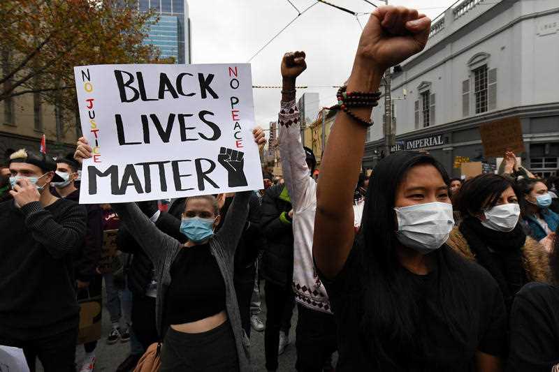 Protesters are seen during a Black Lives Matter rally in Melbourne.